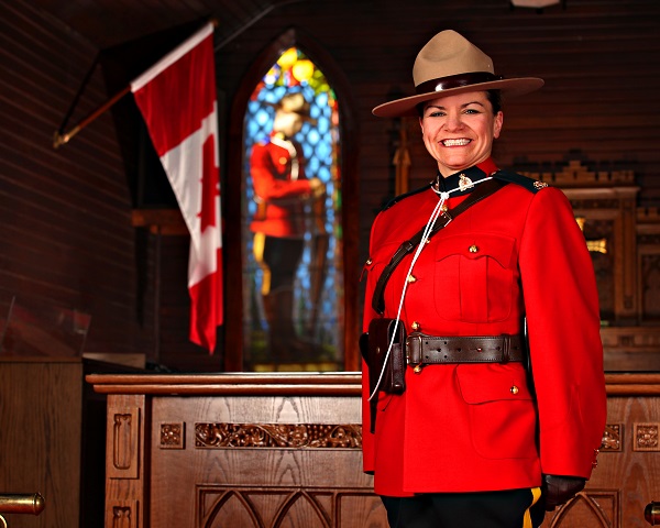 Constable Chantal Mitchell smiling in the Depot church for graduation