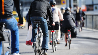 People riding bicycles on the road